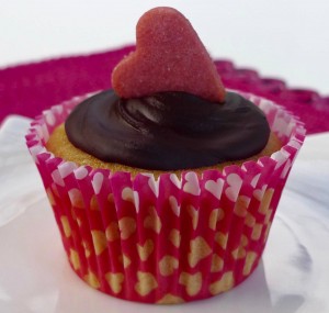 Hidden heart cupcake with chocolate frosting